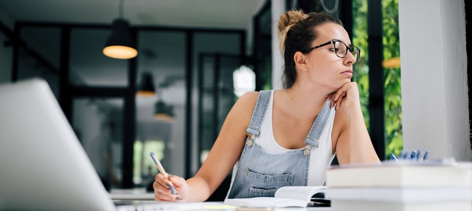 College student getting distracted from her studies