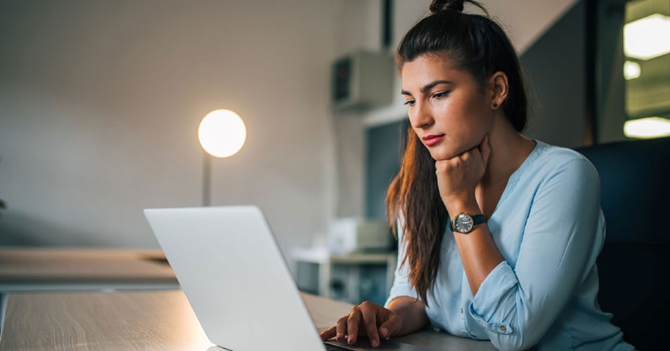 Female student at laptop computer at home