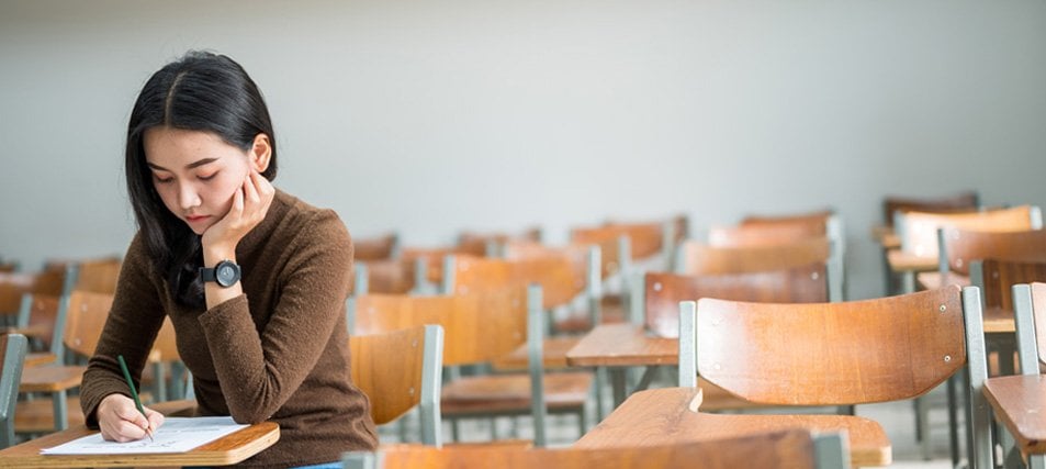 female student in empty clasroom