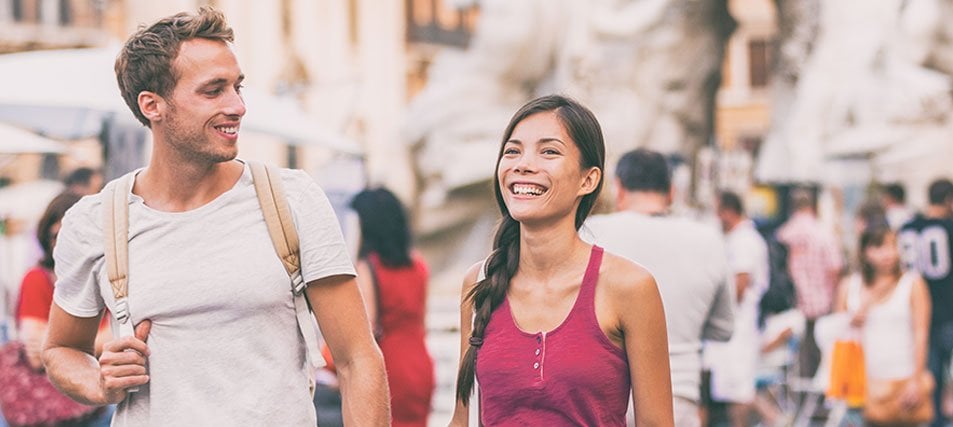 male and female student walking