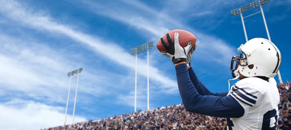 College football player catching a pass