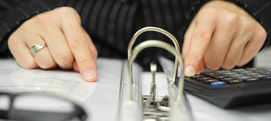 hands scanning a binder